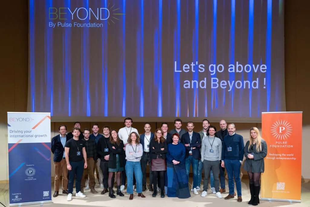 A BEyond cohort on stage under the words "Let's go above and Beyond"